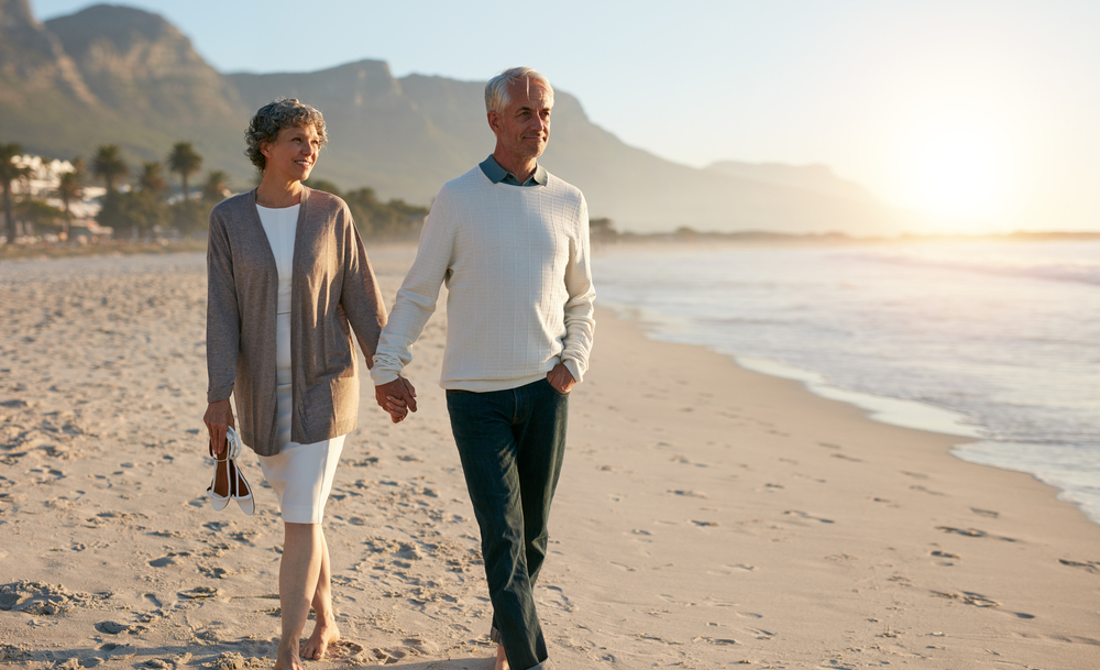 Older couple walking to improve vascular health and DVT. Schedule a screening at The Vein Centre in Cool Springs